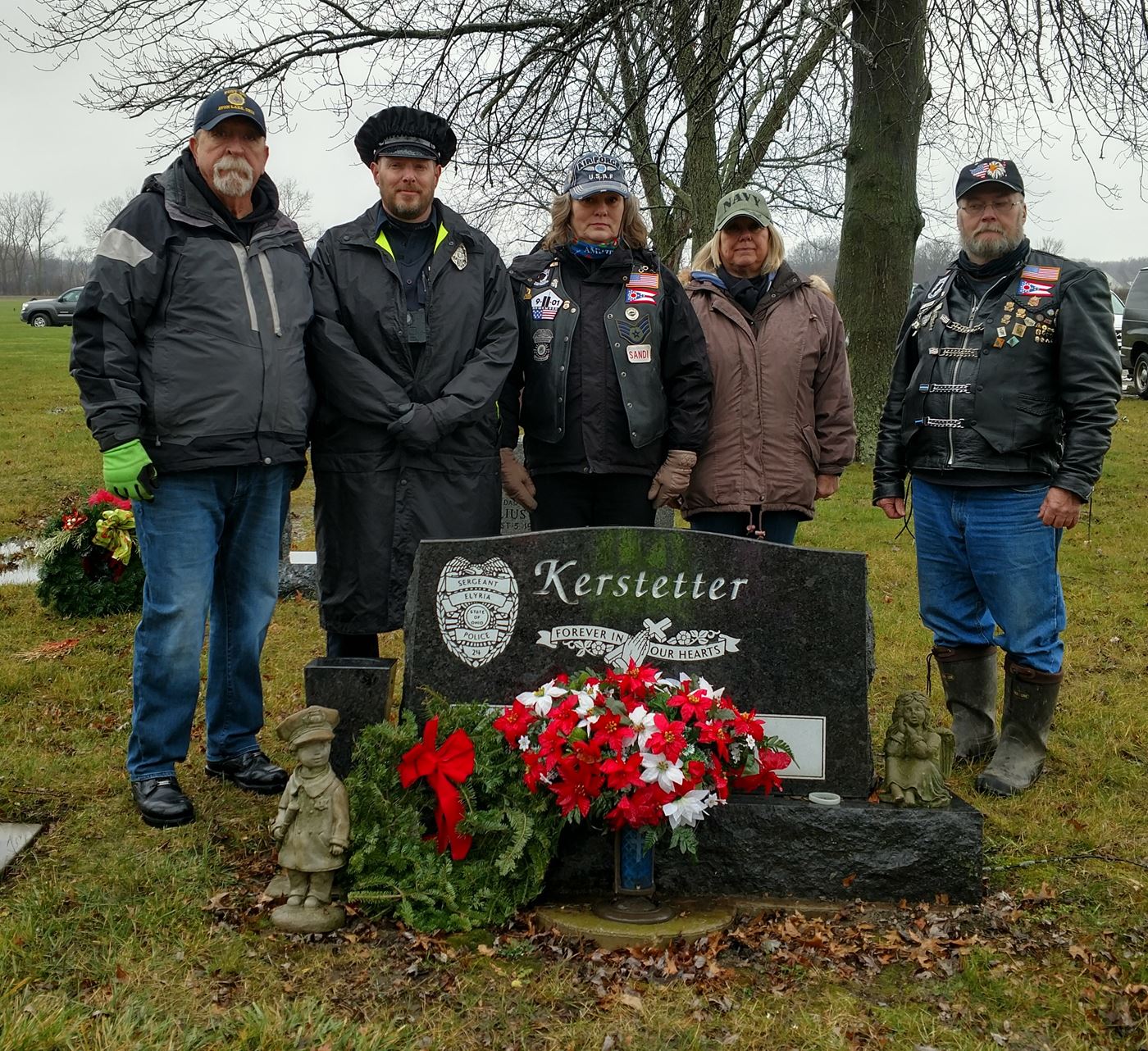 Veterans and Police place a remembrance wreath for Elyria Police Officer