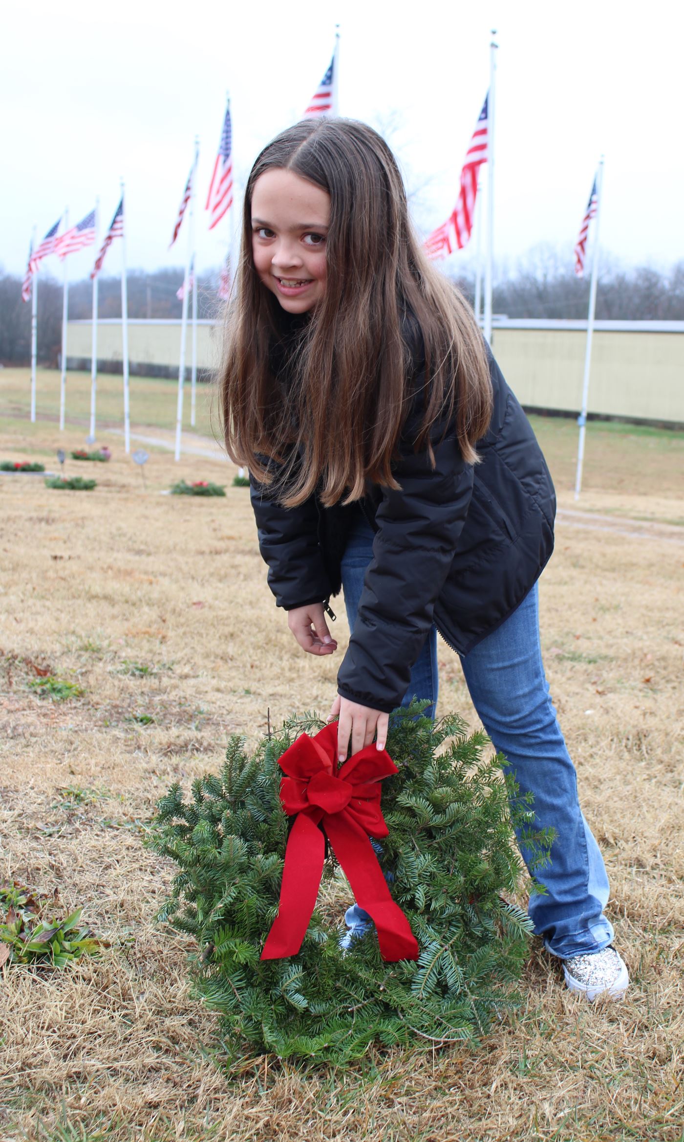 Mtn. View-Birch Tree student helping place wreaths.<br>