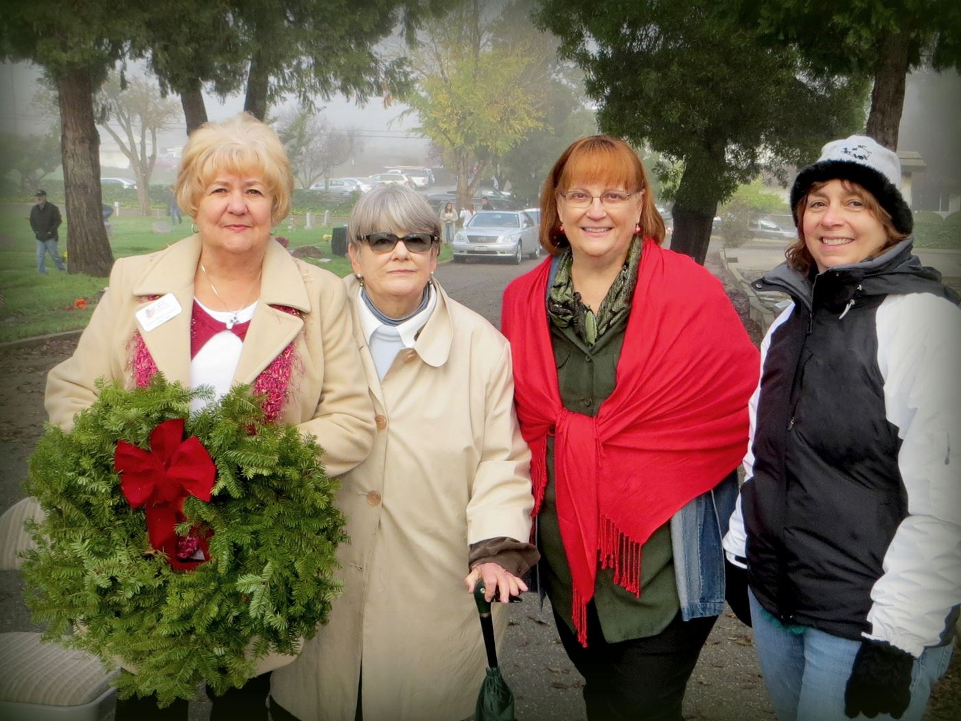 Our chapter of Daughters of the American Revolutions has participated since Morgan Hill started joining the national Wreaths Across America project.  Some of these women have been present every single year.  Left to right: Kris Hernandez, Romaine Veronda, Gaylis Ghaderi, Elizabeth Krafft
Mt. Hope Cemetery, Morgan Hill, California
2014
photo by Jackie Berryhill