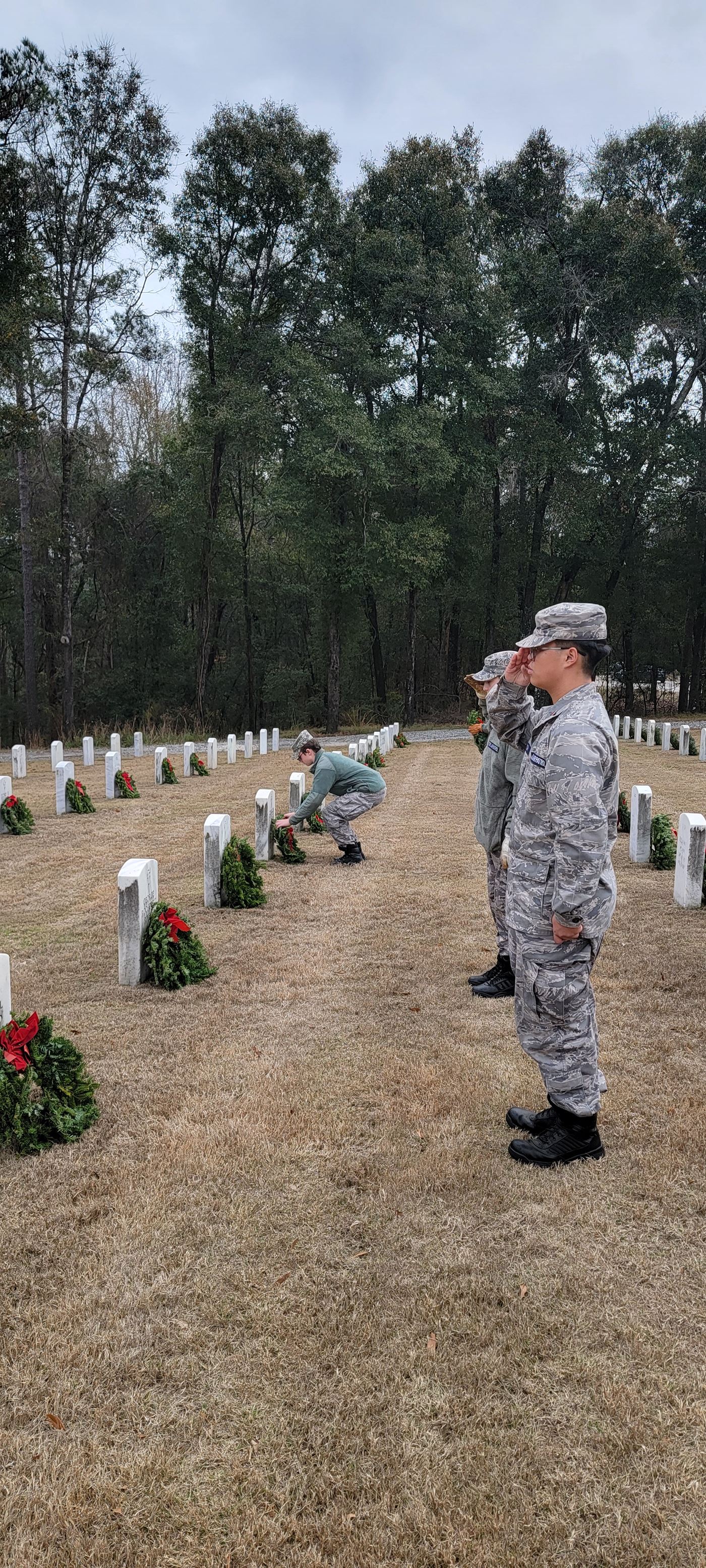 The cadets from Auburn Composite Squadron place the wreaths on the graves and take a moment to acknowledge those that served their nation in peace time and war.