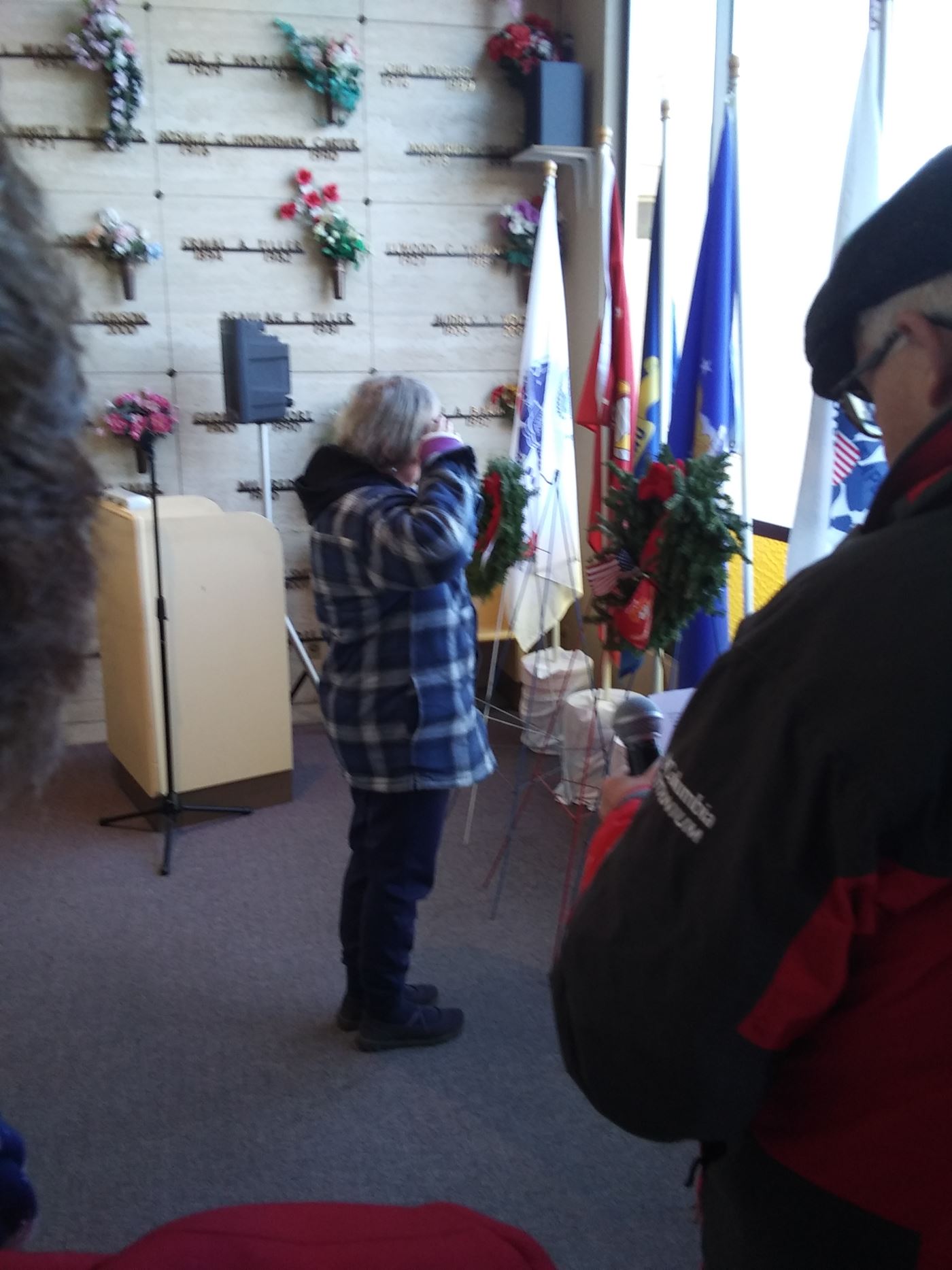 Sergeant Gloria is placing a wreath for her service in the U.S. Marines!