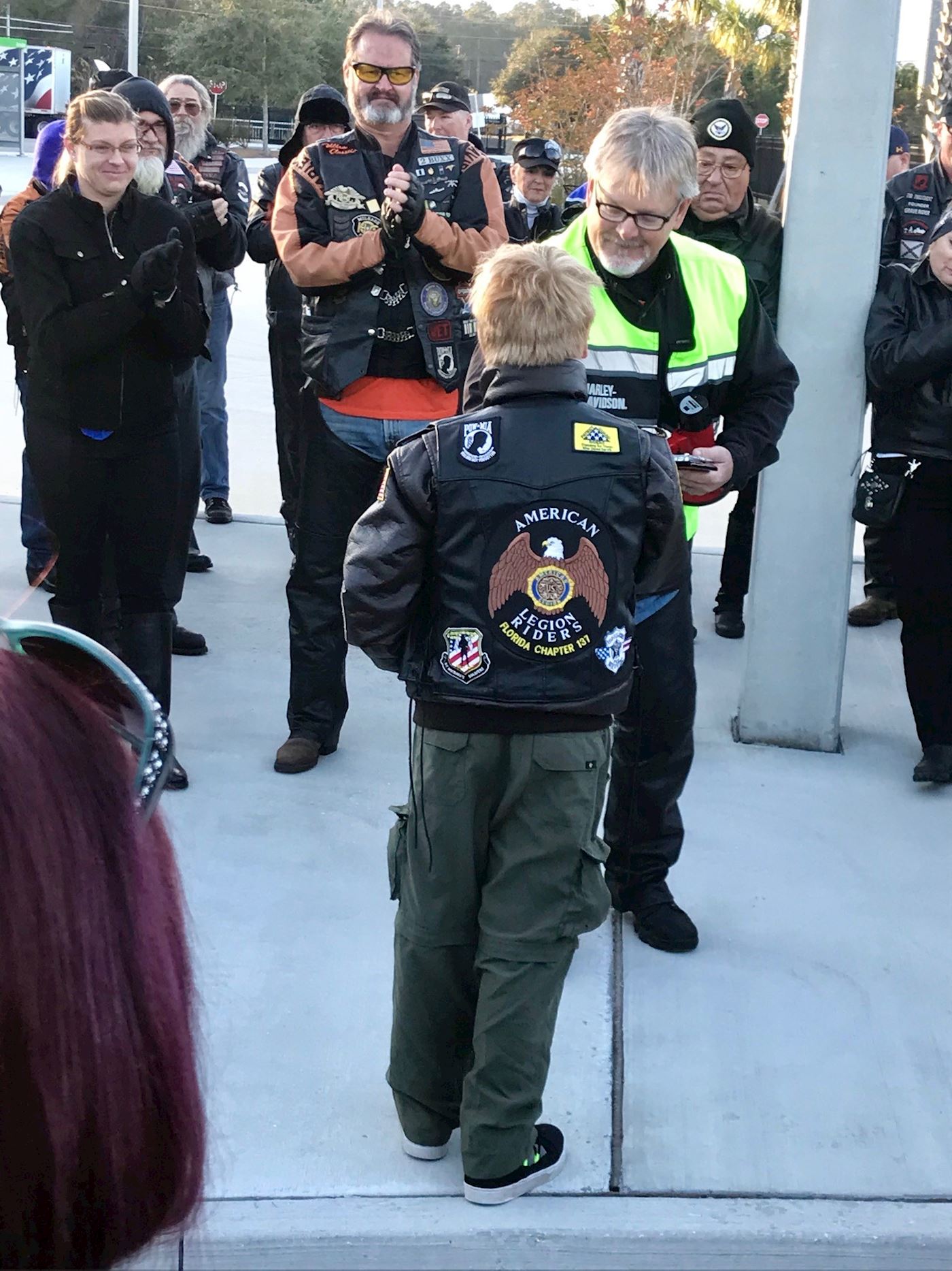 Conner Steele being presented an award for supporting WAA at JNC by raising sponsorships for 167 wreaths, helping place wreaths, and also riding in the motorcycle escort of the wreath trucks.  Conner was representing Pack 522 and ALR 137