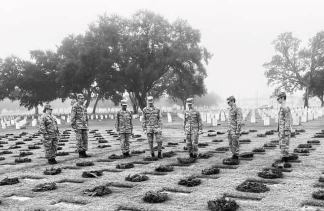 Cadets stand at attention, honoring those who have served and sacrificed for our country.