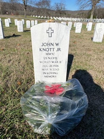 <i class="material-icons" data-template="memories-icon">account_balance</i><br/>John Knott, Navy<br/><div class='remember-wall-long-description'>In loving memory of an amazing man.We love you and miss you.</div><a class='btn btn-primary btn-sm mt-2 remember-wall-toggle-long-description' onclick='initRememberWallToggleLongDescriptionBtn(this)'>Learn more</a>
