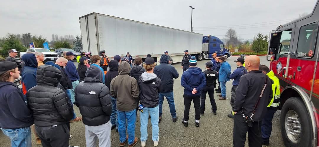 Participants of the 2024 Wreaths Across America Truck Escort Convoy were assembled together for a safety briefing prior to departure from the assembly point at the back of Safeway on 708 Shaw Rd, Puyallup,&nbsp; WA.