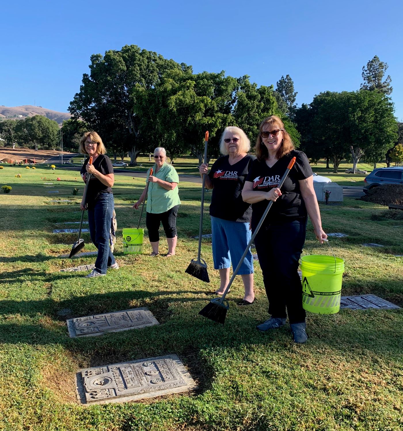 Members of the Mojave Chapter, NSDAR help clean the gravestones of our fallen heroes.