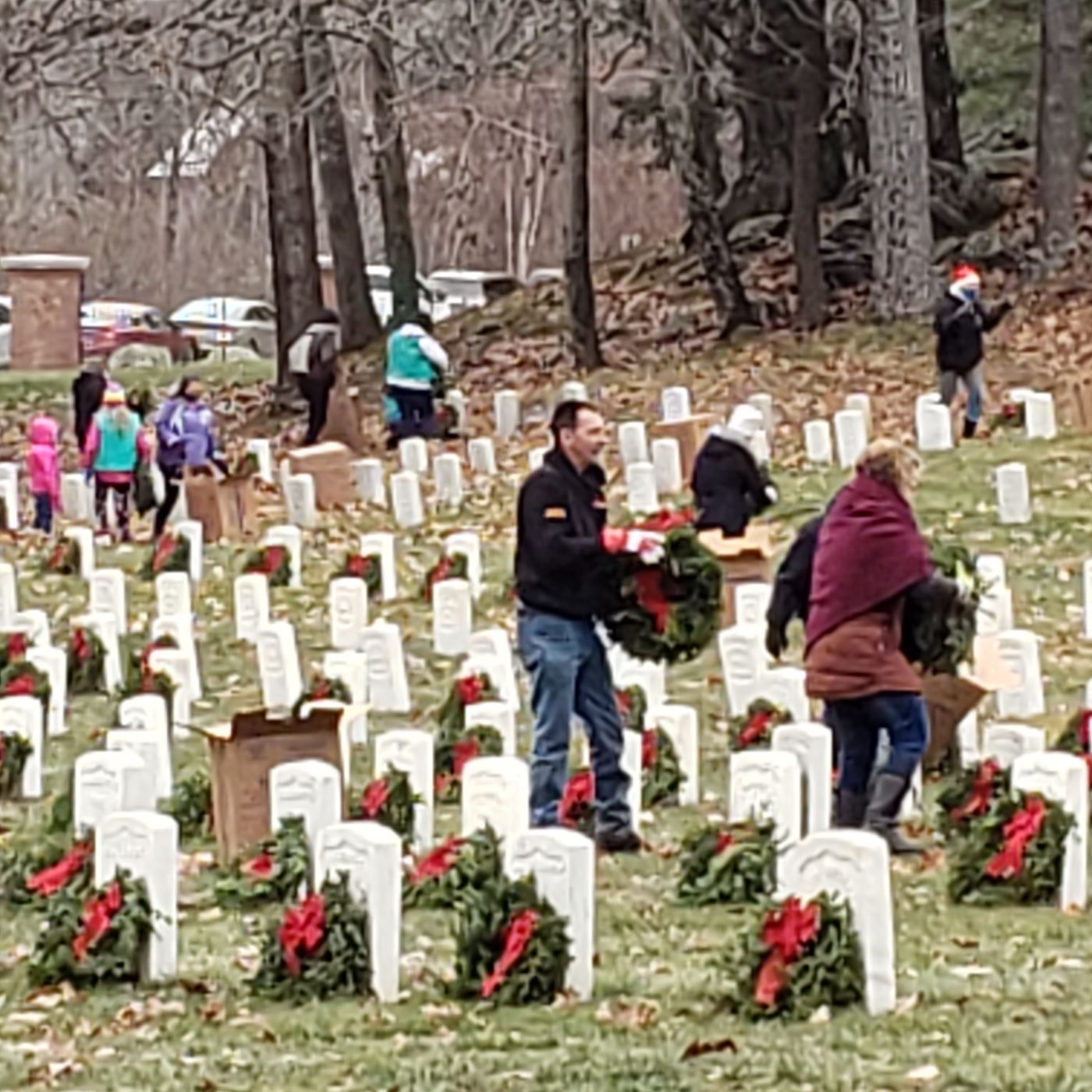 Volunteers placing wreaths on December 18, 2021