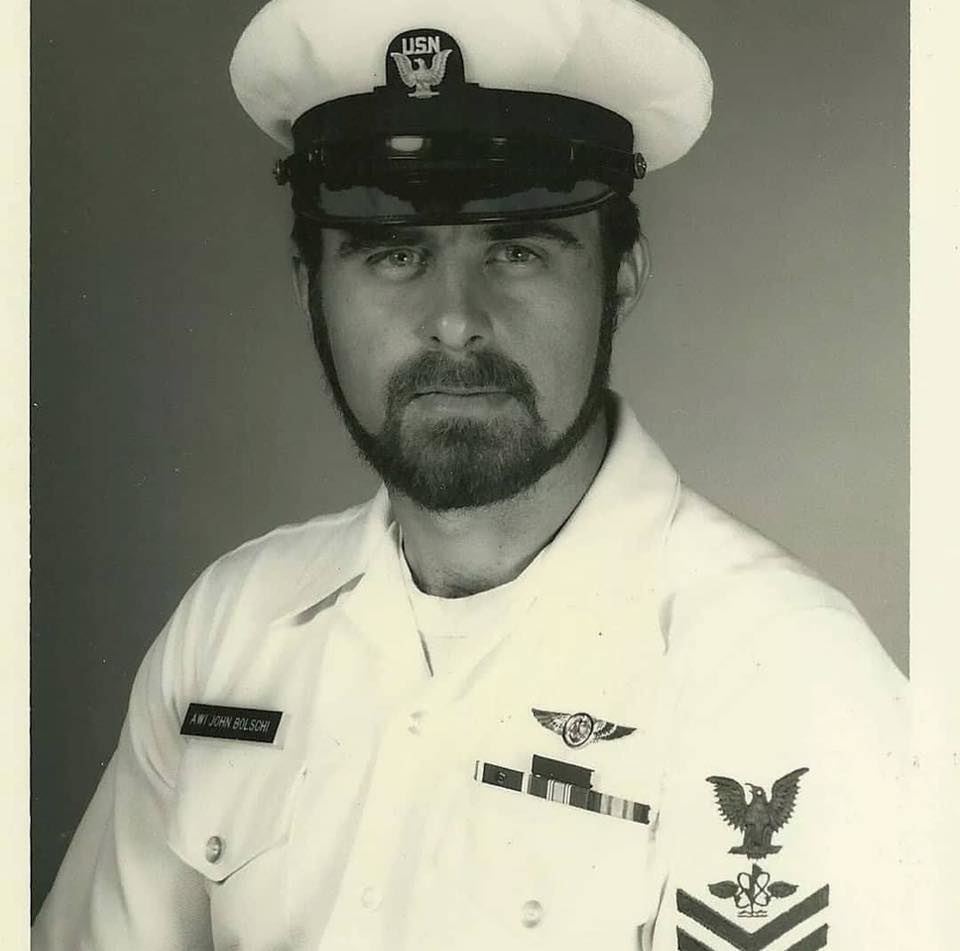 <i class="material-icons" data-template="memories-icon">account_balance</i><br/>John  Bolschi, Navy<br/><div class='remember-wall-long-description'>
  In Loving memory of John Bolschi, you are truly missed by all.</div><a class='btn btn-primary btn-sm mt-2 remember-wall-toggle-long-description' onclick='initRememberWallToggleLongDescriptionBtn(this)'>Learn more</a>