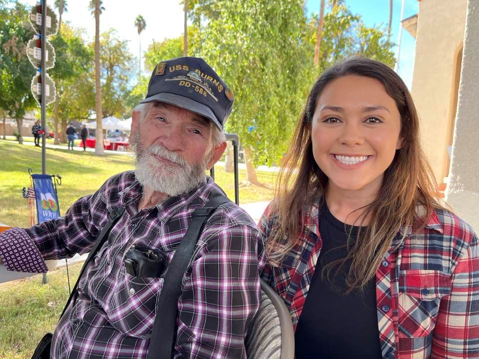 Veterans and friends visit the Wreaths Across America Desert Palm Chapter DAR booth at the Veterans Day Parade in Holtville, California 2022.