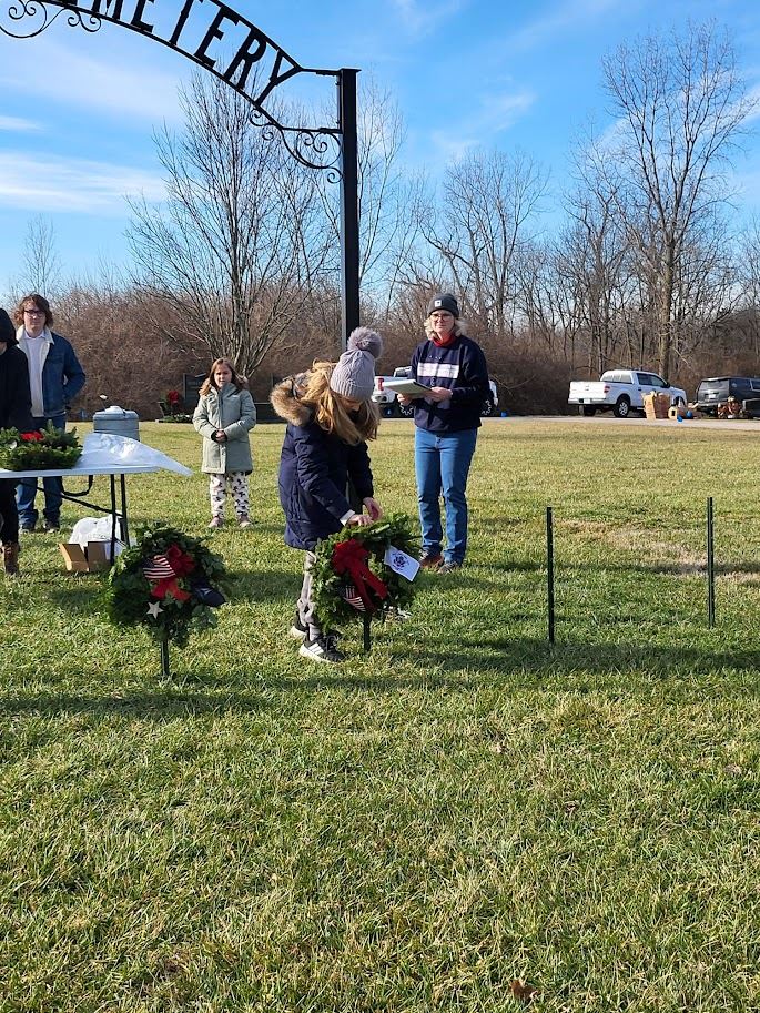 Stella Albaugh presenting the Coast Guard wreath.