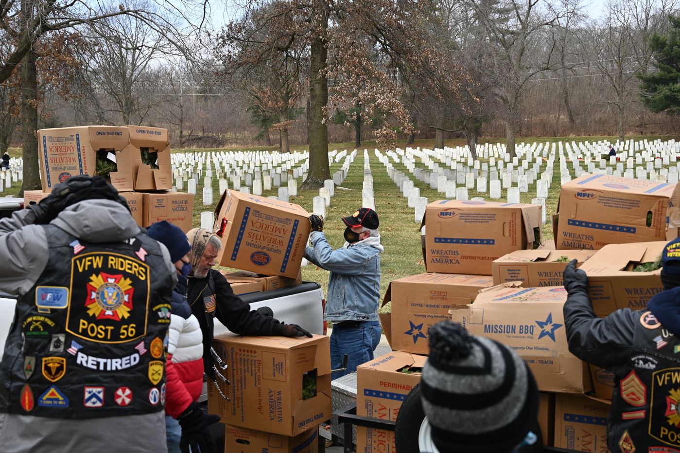 CGSC Foundation President/CEO Rod Cox, center, assists with unloading wreaths on Dec. 19, 2020, at the Fort Leavenworth National Cemetery.