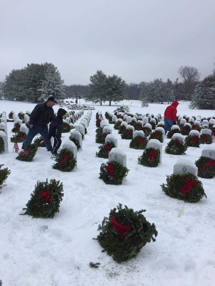 Volunteers placing wreaths  at the State Veterans Cemetery in Middletown on national Wreaths Across America Day December 17, 2016
