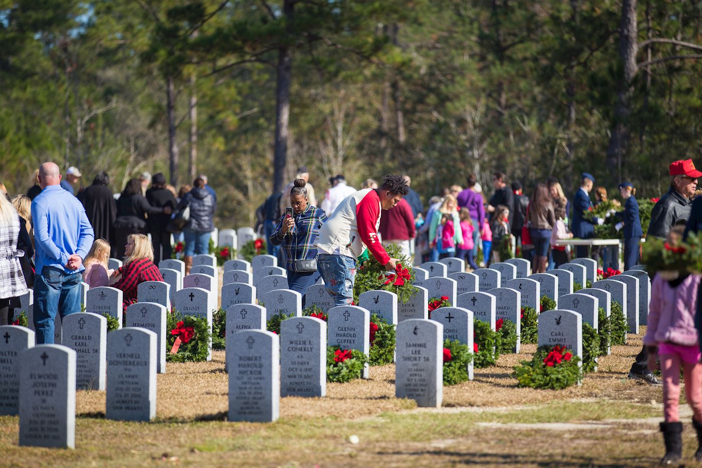 Families of loved ones place wreaths during our 2017 ceremony