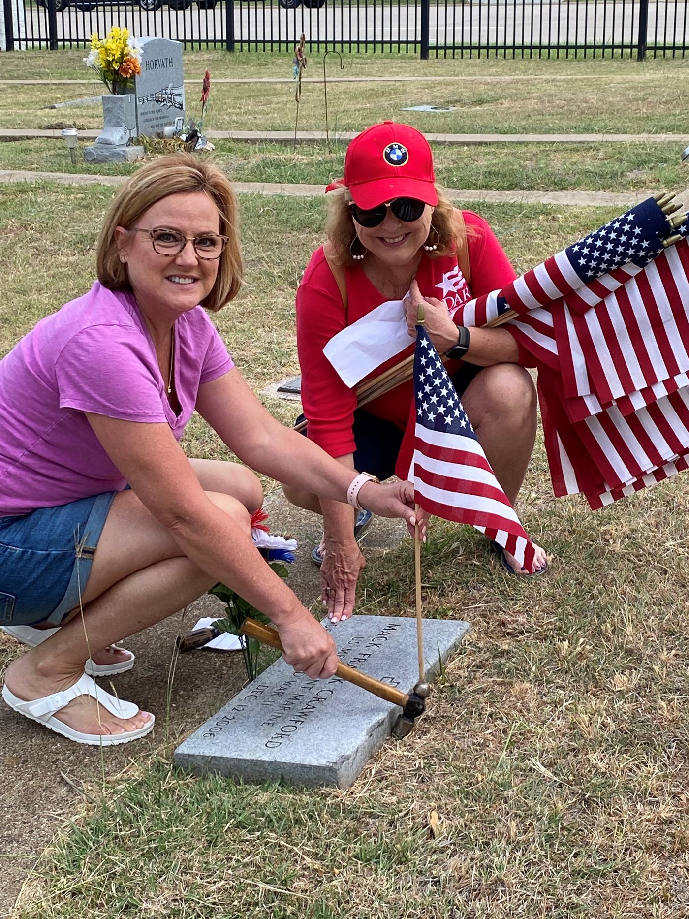 Members of The Flower Mound Chapter NSDAR placing Memorial Day Flags 2022.