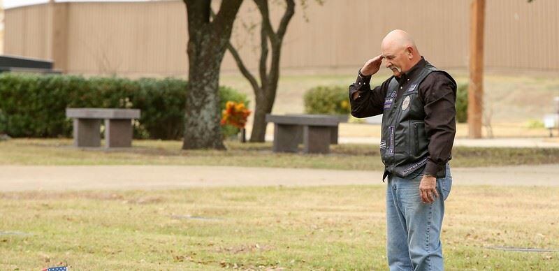 Americas Guardians MC TX28A President, Mike 'Mad Dog' Meek, rendering final salute after placing a wreath.

Photo credit: Teri Myers 