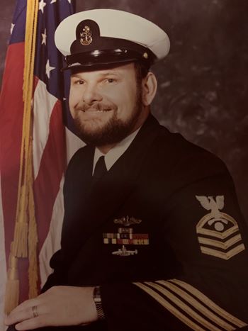 <i class="material-icons" data-template="memories-icon">account_balance</i><br/>Peter Douglass, Navy<br/><div class='remember-wall-long-description'>
  We love and miss you, Daddy!</div><a class='btn btn-primary btn-sm mt-2 remember-wall-toggle-long-description' onclick='initRememberWallToggleLongDescriptionBtn(this)'>Learn more</a>