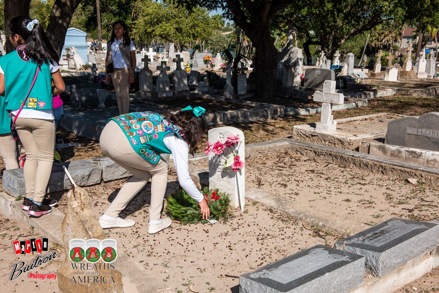 Our Girl Scouts laying the wreath on a veteran's tomb