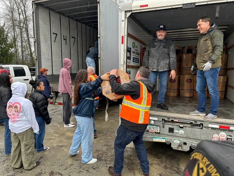 At the end of the 2024 Wreaths Across America Truck Escort Convoy in Orting, WA, Dozens of Participants were transferring 190 cases of Wreaths to smaller trucks for staging at the WA Soldier's Home Cemetery.&nbsp;&nbsp;