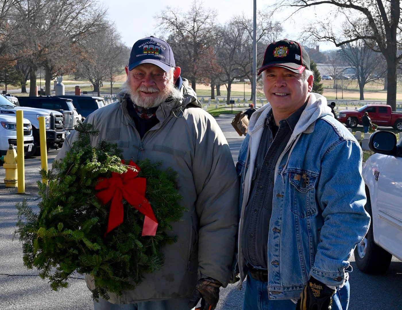 Col. (Ret.) Lynn Rolf, Jr., left, and CGSC Foundation President/CEO Rod Cox visit after laying wreaths on veterans’ graves Dec. 19, 2020. Rolf was representing VFW Post 56 in Fort Leavenworth and has worked on the Wreaths Across America project for several years.