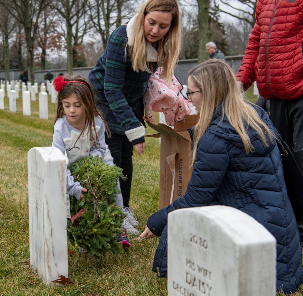 Family Placing a Wreath to honor our veterans