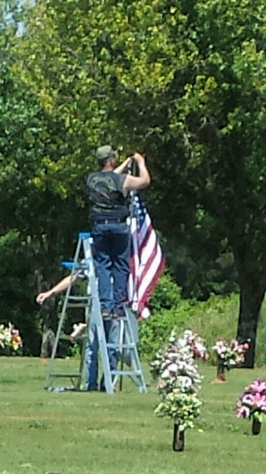 Preparing cemetery with not only wreaths but, our countries colors.
