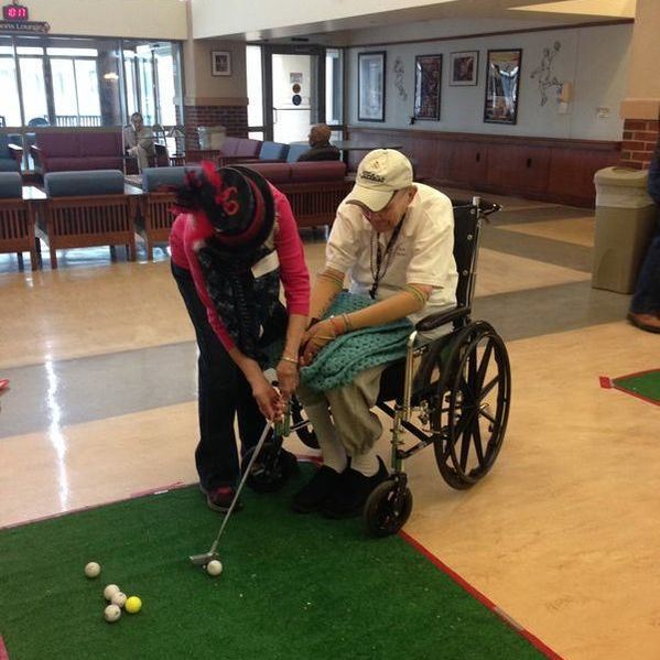 Volunteers are paired with a veteran for personal,
?one-on-one playing time during the annual Crazy Hat Golf event hosted by Jersey Blue at the Menlo Park Veterans' Home. Every player gets a prize, but it is always the hats that make it the most fun!