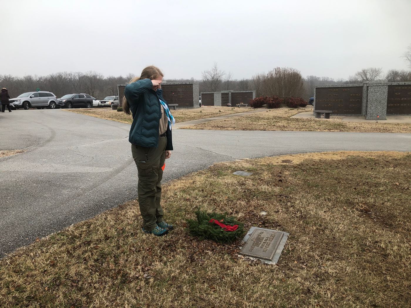 Izabelle C pays honor to fallen serviceman.