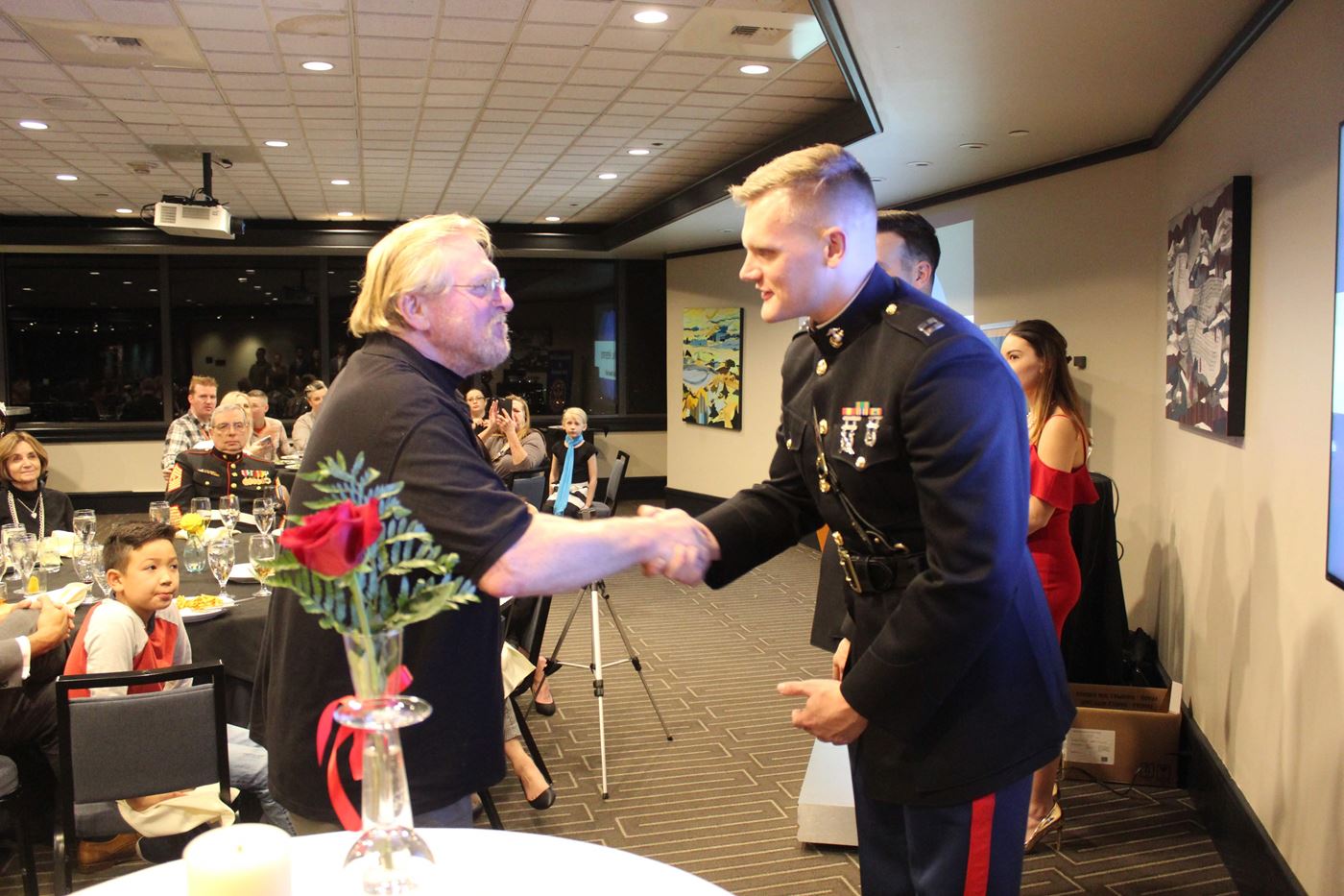 Local veteran receiving a peace pin from a local USMC officer stationed in Bangor, WA