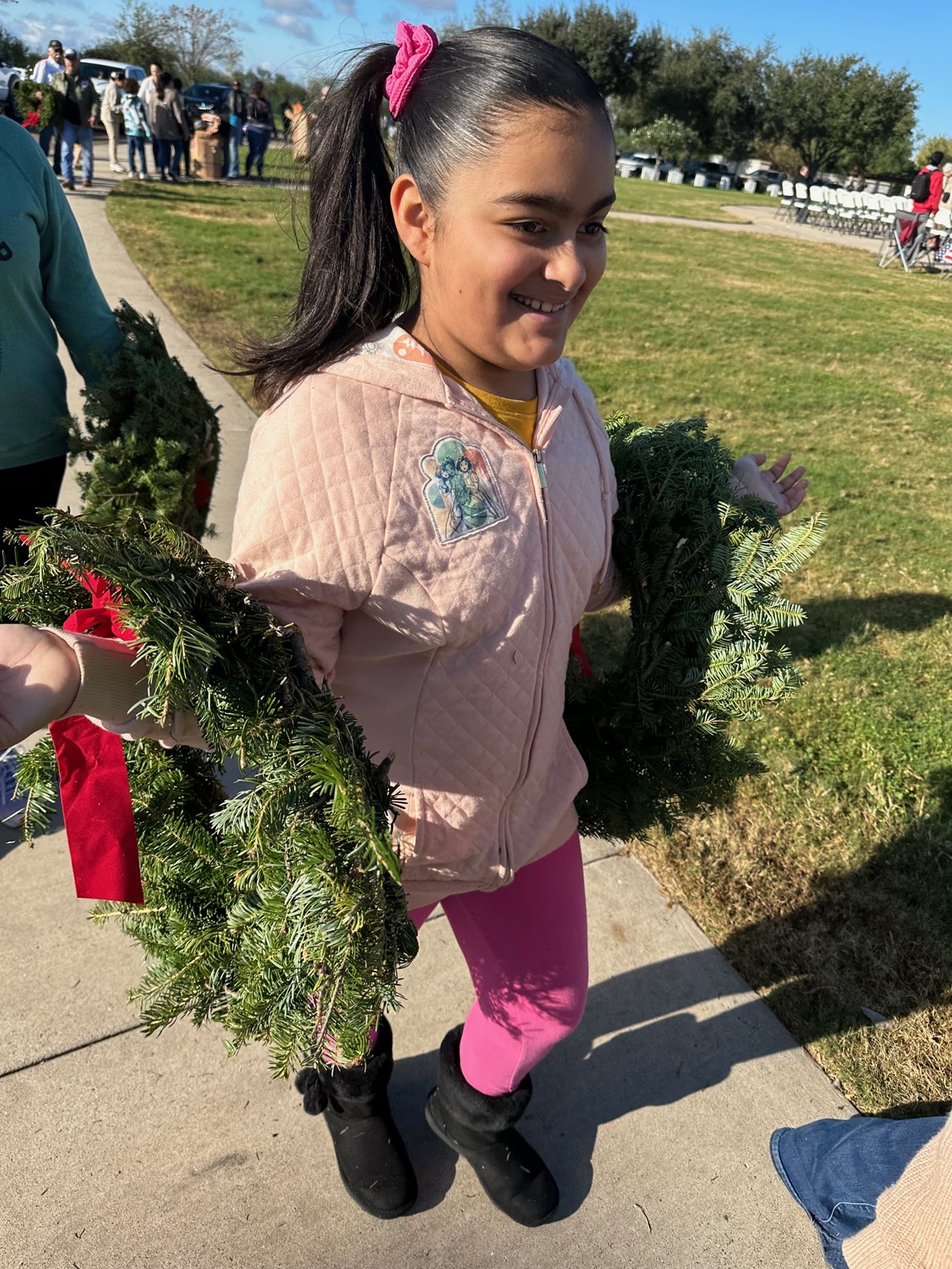 Ava helping to place wreaths for all veterans.