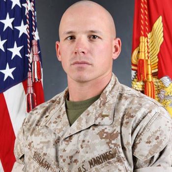<i class="material-icons" data-template="memories-icon">message</i><br/>Captain Brock Budash, Marine Corps<br/><div class='remember-wall-long-description'>Never forgotten…forever loved
Dad & Mom</div><a class='btn btn-primary btn-sm mt-2 remember-wall-toggle-long-description' onclick='initRememberWallToggleLongDescriptionBtn(this)'>Learn more</a>