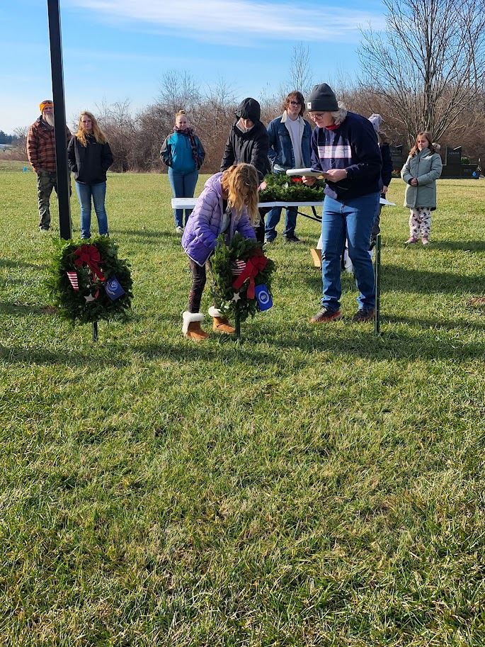 Laurel Bookman presenting the Air Force wreath.