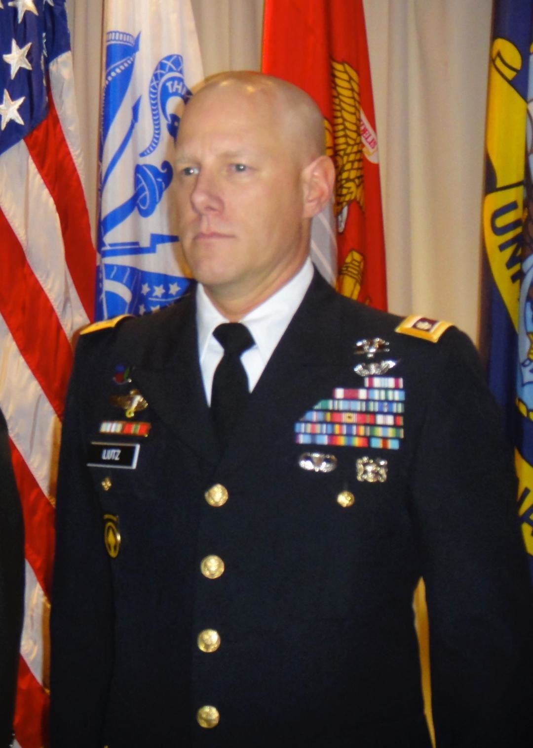 <i class="material-icons" data-template="memories-icon">chat_bubble</i><br/>Clifford Lutz, Jr., Army, Colonel<br/>Posted by: Krista Lutz<br/><div class='remember-wall-long-description'>Dedicated soldier, compassionate physician, beloved family member</div><a class='btn btn-primary btn-sm mt-2 remember-wall-toggle-long-description' onclick='initRememberWallToggleLongDescriptionBtn(this)'>Learn more</a>