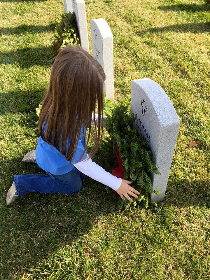 Nora placing one of many wreaths, December 2015.