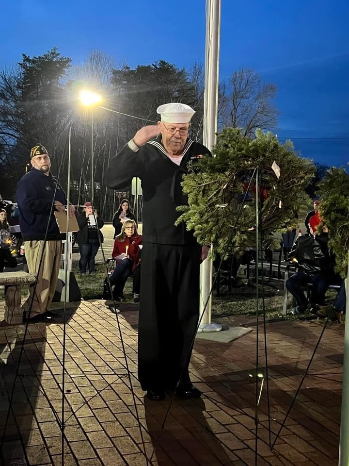 Navy veteran placing ceremonial wreath