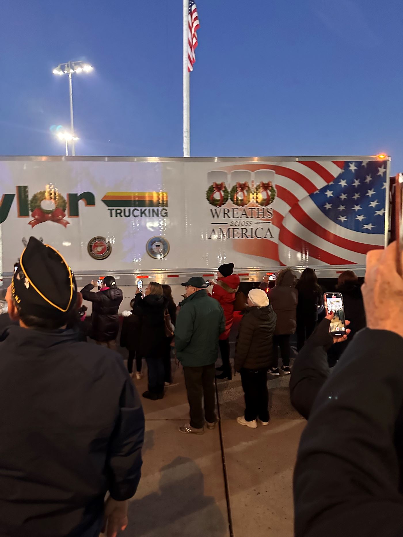 Crowd watches convoy arrive