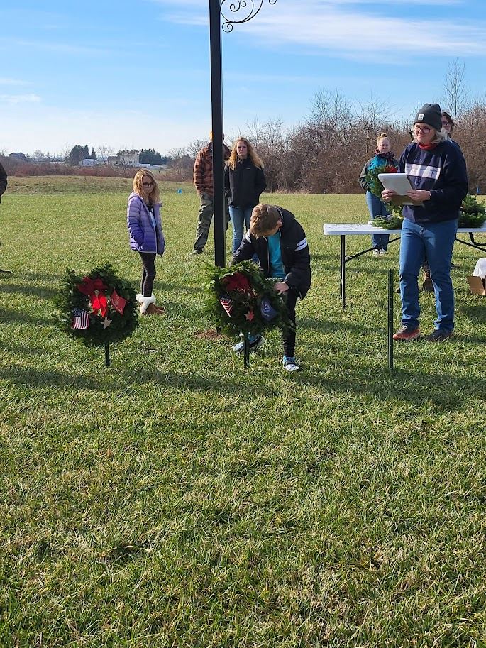 Beau Calland presenting the Navy wreath.