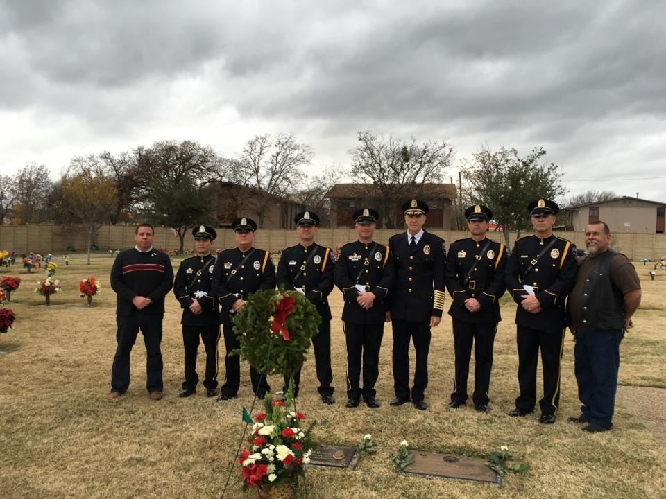 IPD Chief Larry Boyd and IPD Honor Guard at the grave of LOD, Officer Aubrey Hawkins who was killed on December 24, 2000.