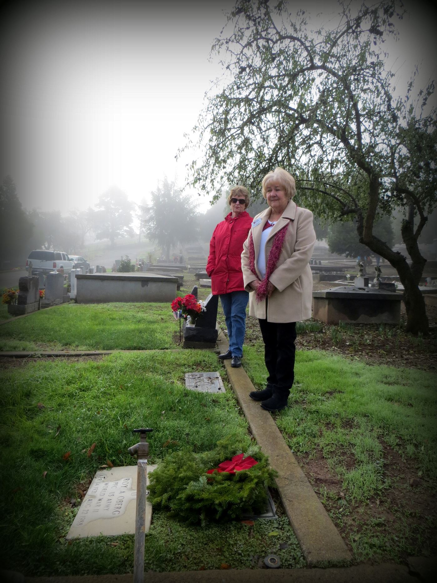 Gabilan members lay wreaths with family members.  All participants in the Wreaths Across America ceremony are encouraged to pause, speak or pray at the grave, honor and remember the departed veterans.  Mt. Hope Cemetery, Morgan Hill, California