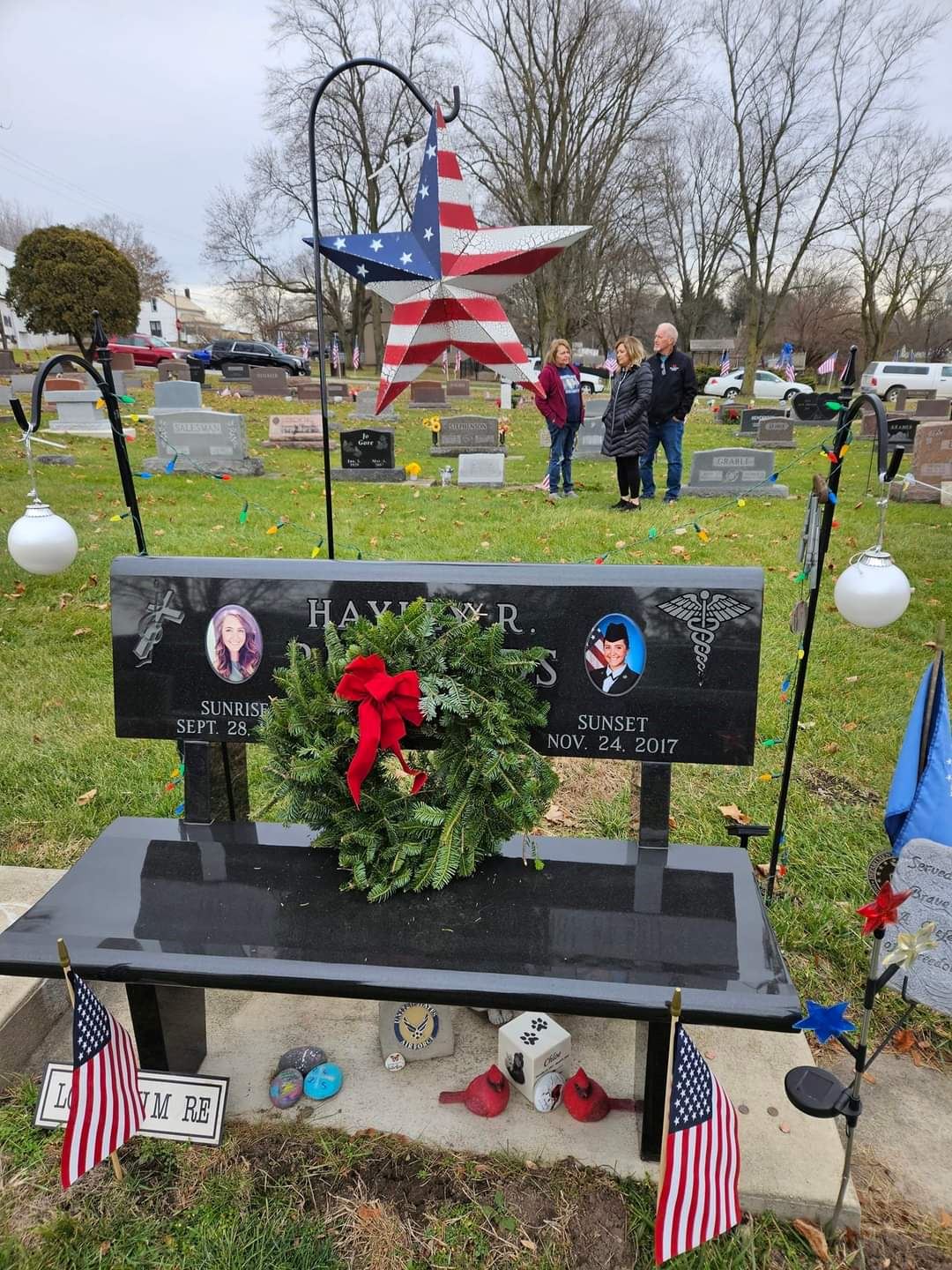 Placement of the wreath on a bench monument to honor this Air Force Veteran<br>