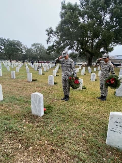 Placing a wreath and offering a final salute, these cadets pay tribute to our veterans.