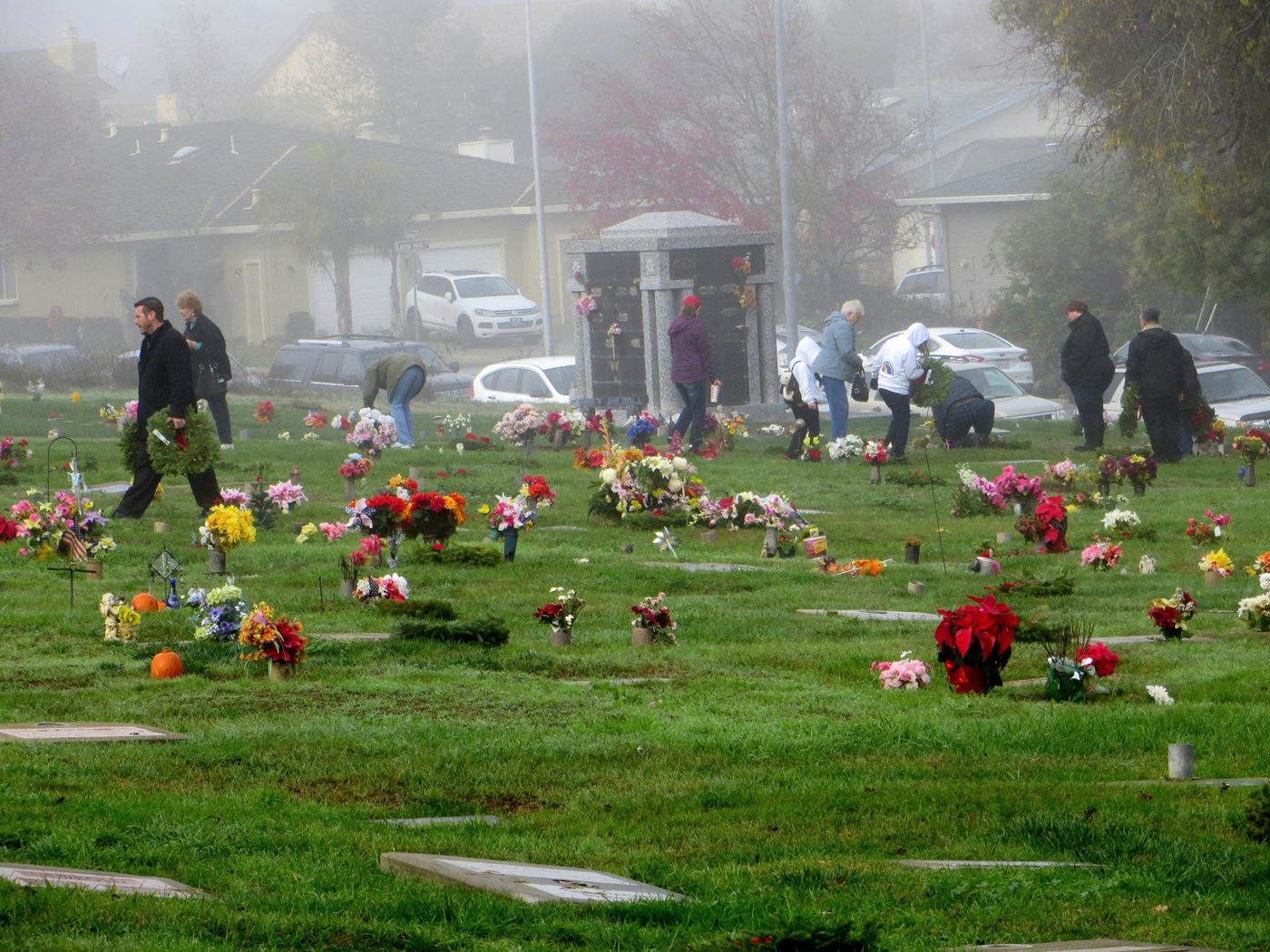 Early in the morning, each veteran's grave is marked with an American flag.  Citizens of all ages then walk the cemetery and lay wreaths.