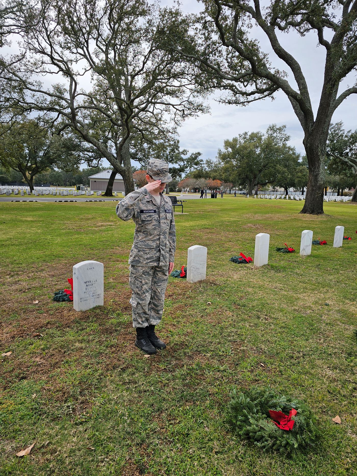 Saluting with pride. Cadet Bouchard pays tribute to those who served with honor at Biloxi National Cemetery.