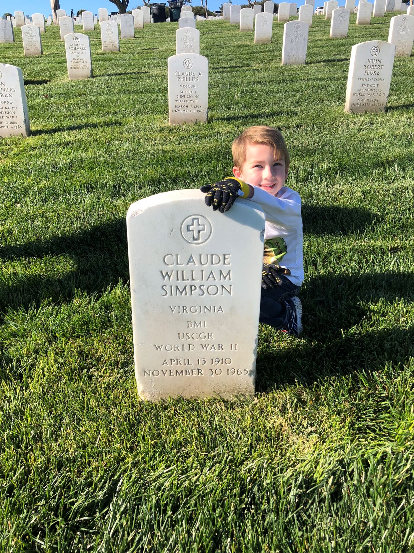 Mason Moore honors family friend Claude Simpson by placing a wreath December 2021.