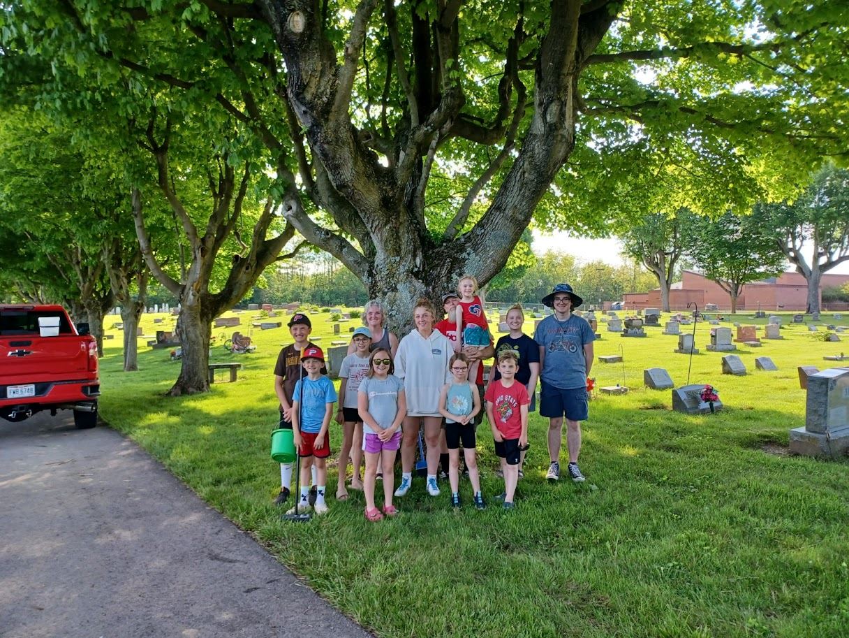 Monroe Winners clean the cemetery the weekend before Memorial Day.