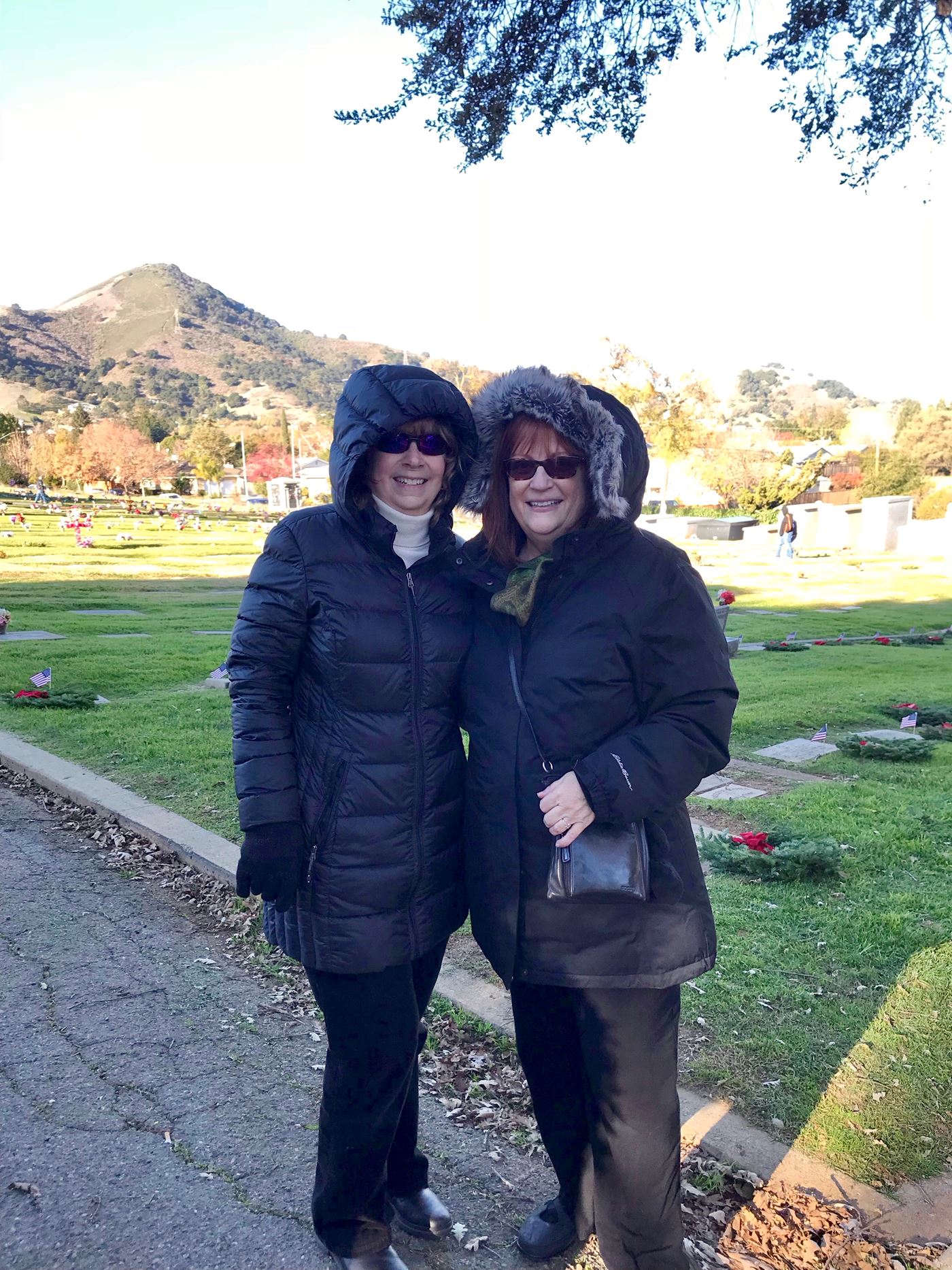 Some years are warm, some years its cold, rain or fog - Gabilan Chapter DAR members have joined with citizens of all ages at Wreaths Across America since it first came to Morgan Hill.
Elizabeth Krafft (left) and Gaylis Ghaderi arrive in several layers.
Mt. Hope Cemetery, Morgan Hill, California
2017
Photo by Kris Hernandez