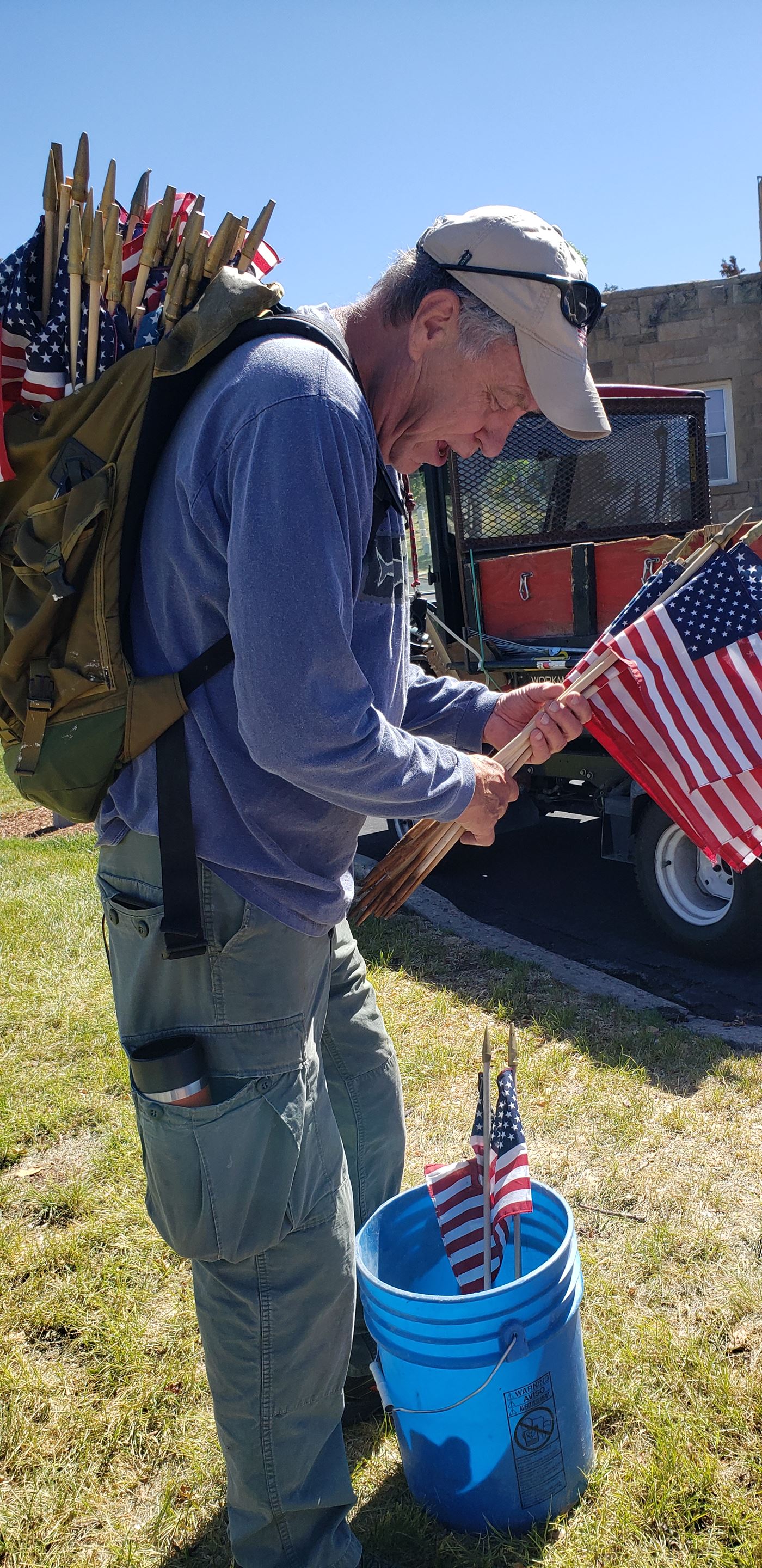 A bucket and a backpack help to retire flags