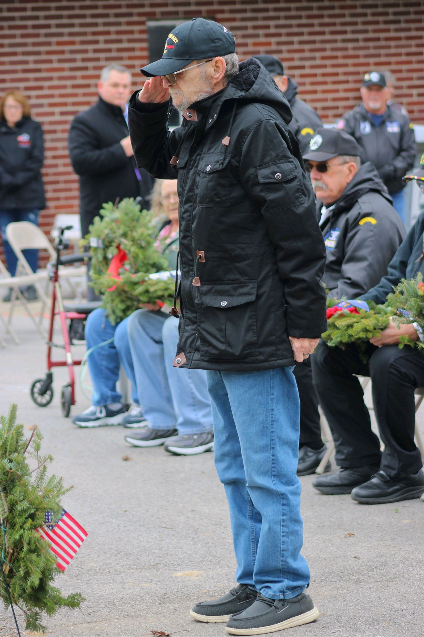 Jim Schrader Vietnam Army Veteran, Purple Heart salutes the Army wreath<br>