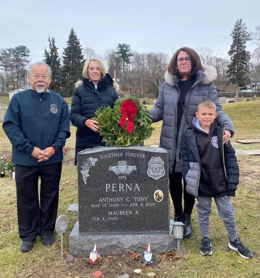 State Rep Donald Wong helping place wreaths