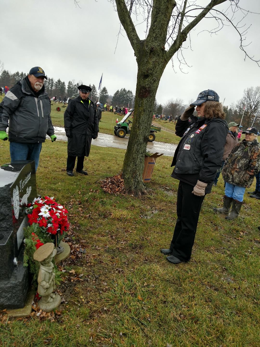 A veteran shown saluting a veteran during Wreaths Across America 2021