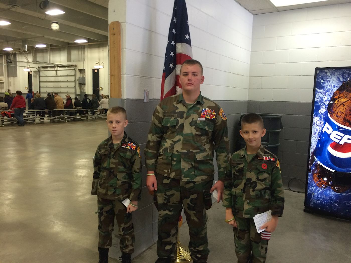 Young Marines distributing Wreaths Across America information at Veterans Day Service - 2015